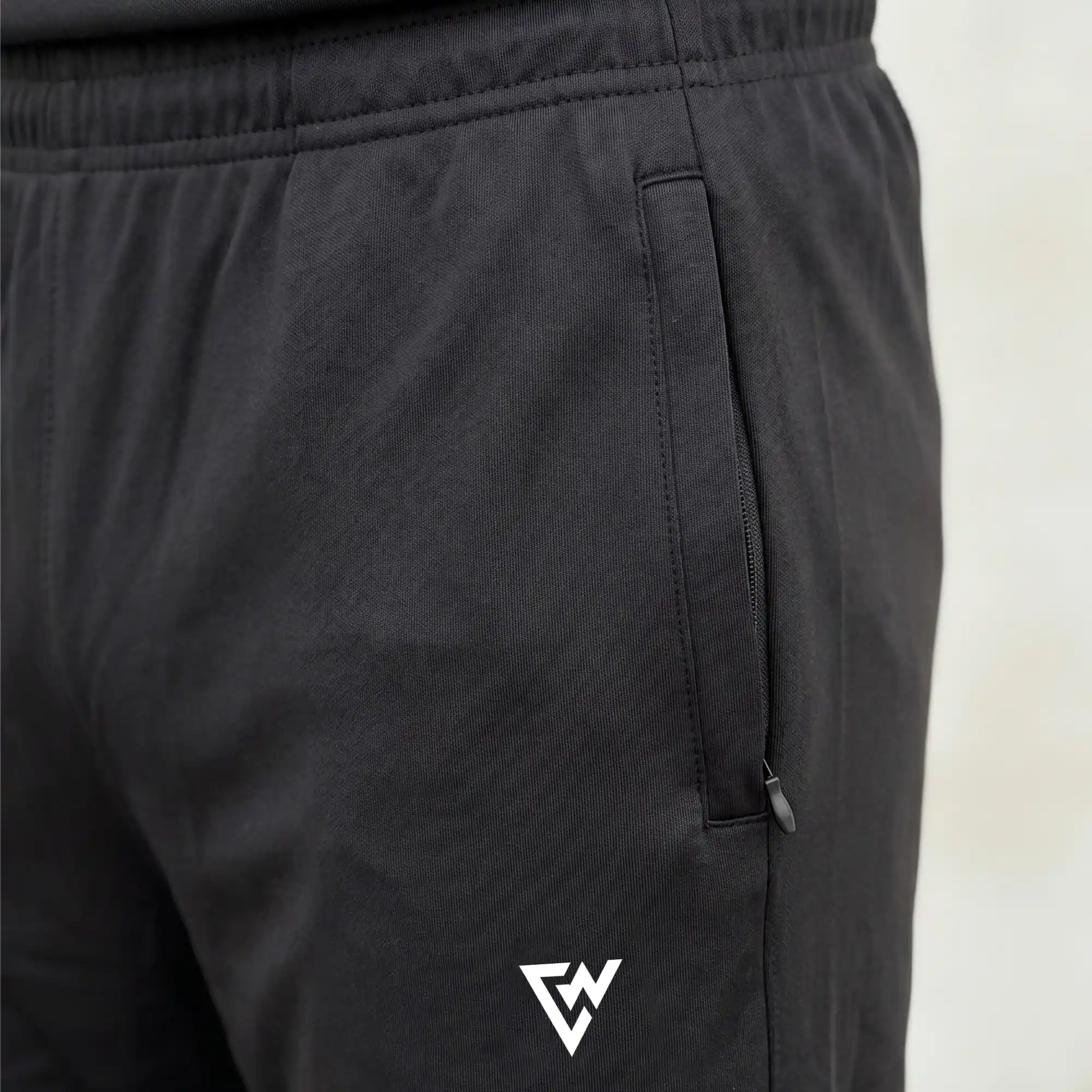 Black athletic trouser zipper pocket detail with performance fit