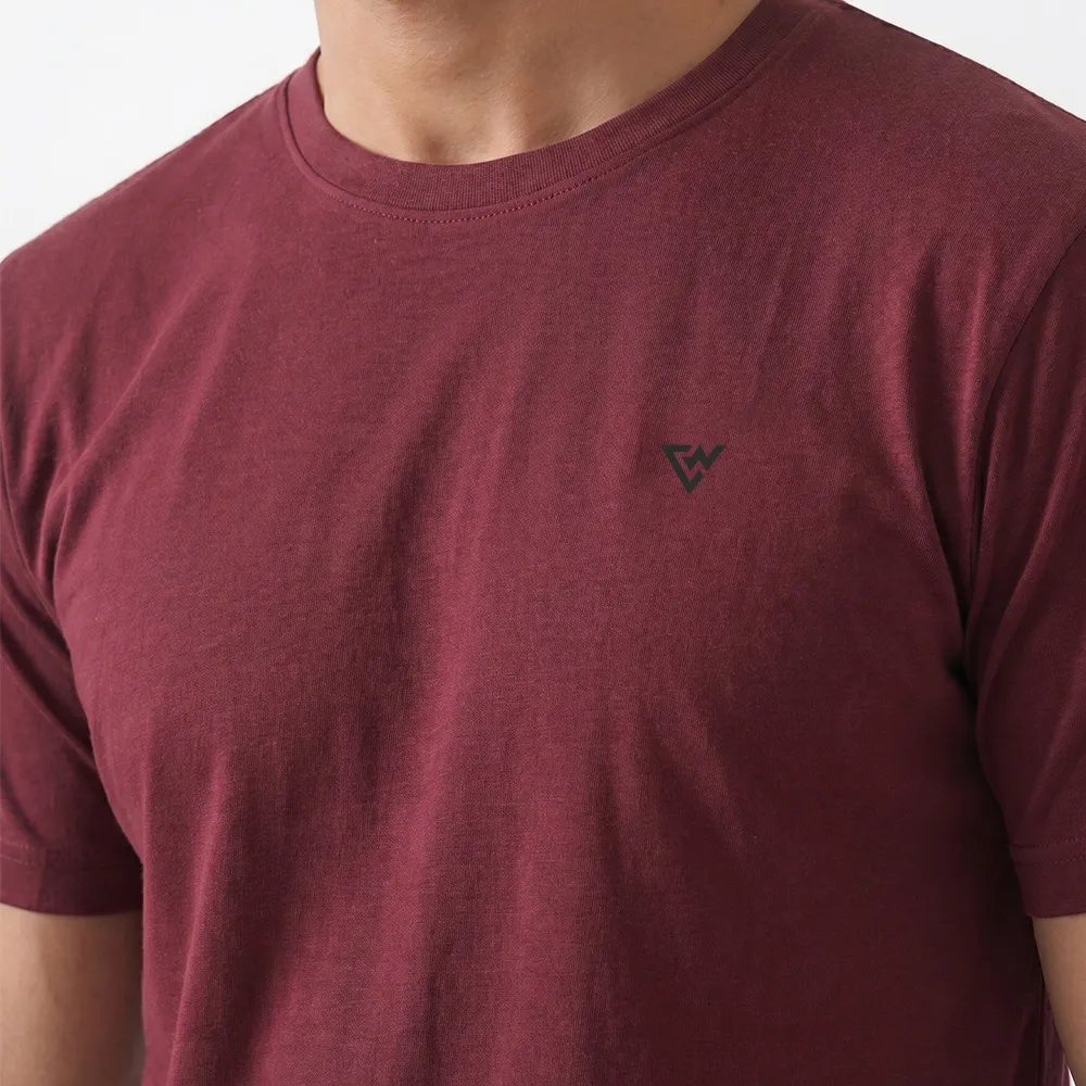 Closeup of men's maroon casual t shirt fabric and logo detail