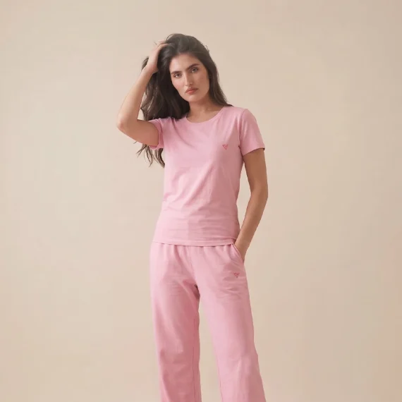 Woman wearing a pink summer lounge set with matching trousers